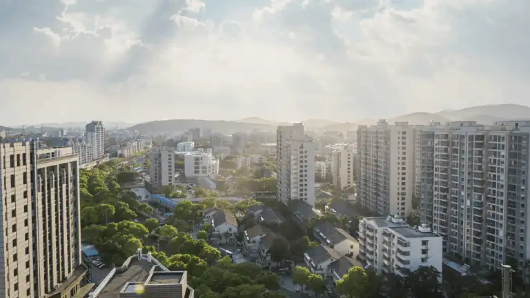 a city with many tall buildings and trees